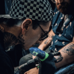 Lucas in action doing a tattoo