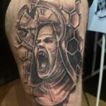 Thigh tattoo
